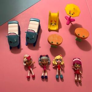 Lot of Shopkins dolls, 2x sleds, 2x tables, slide and umbrella